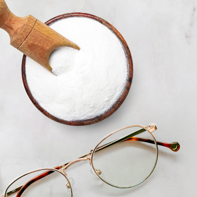 baking soda and glasses on neutral background